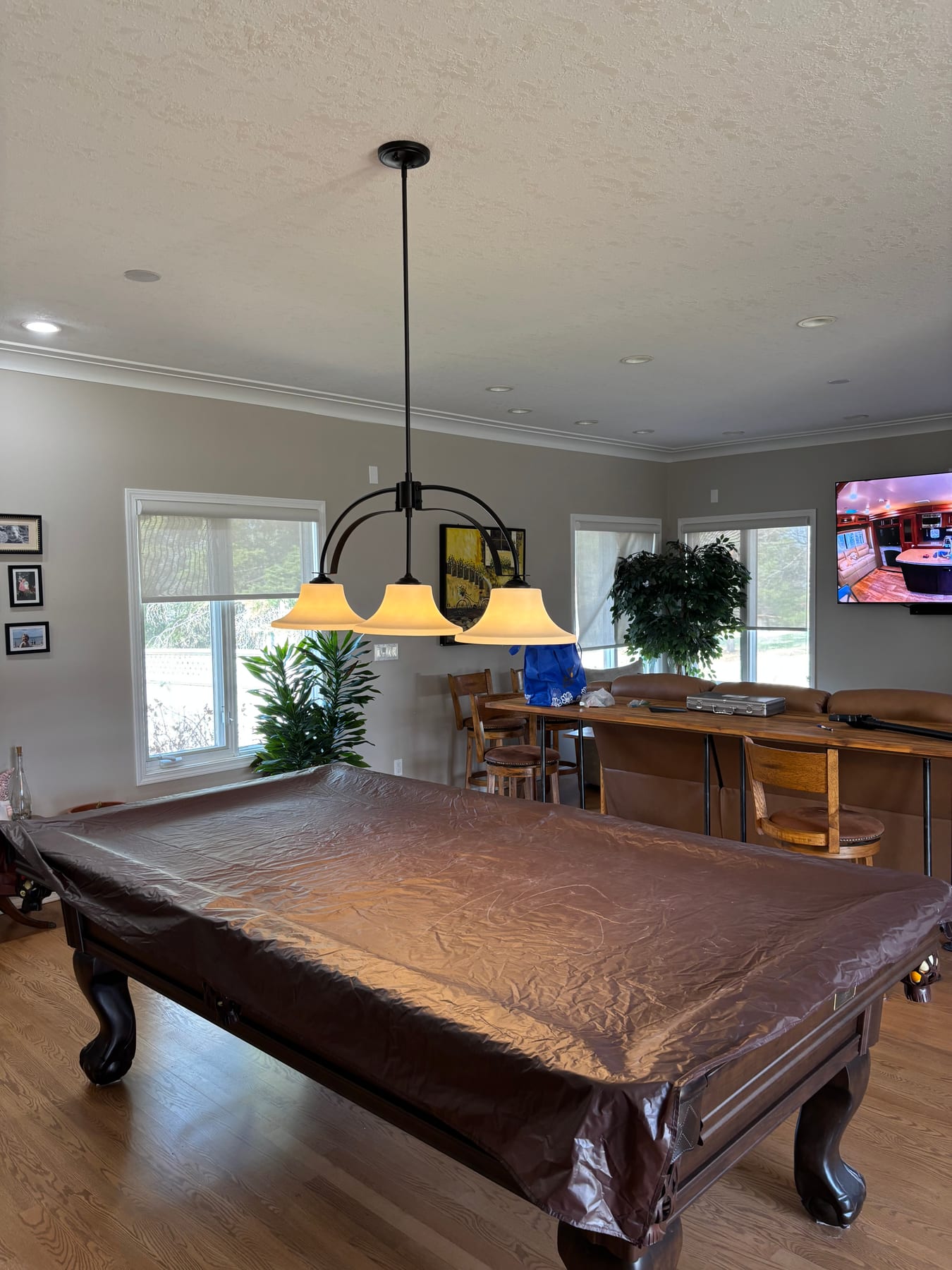 Games room with custom pendant lighting installed by Call Paul Contracting in Edmonton
