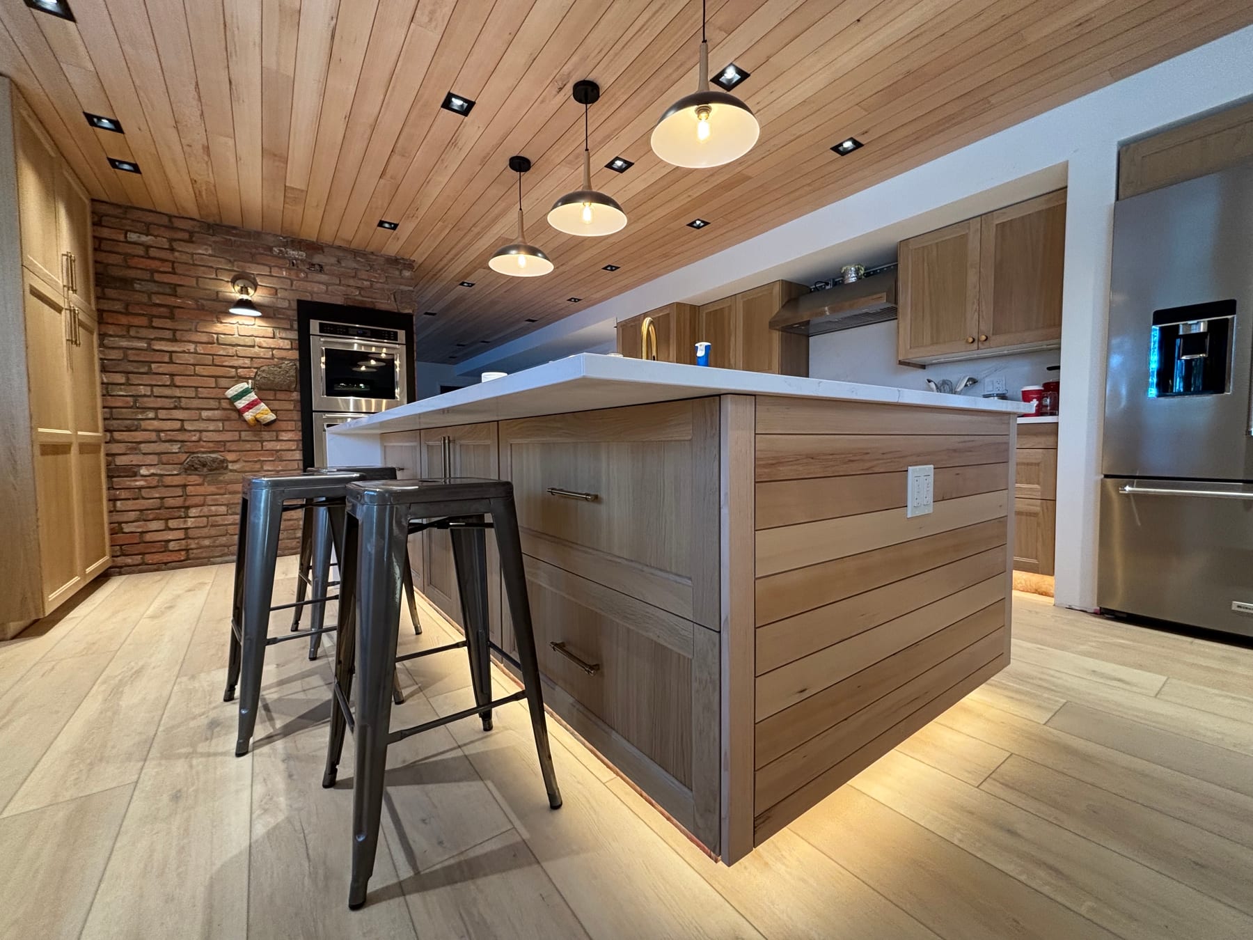 Custom kitchen pendant and pot lighting installed by Call Paul Contracting, Edmonton