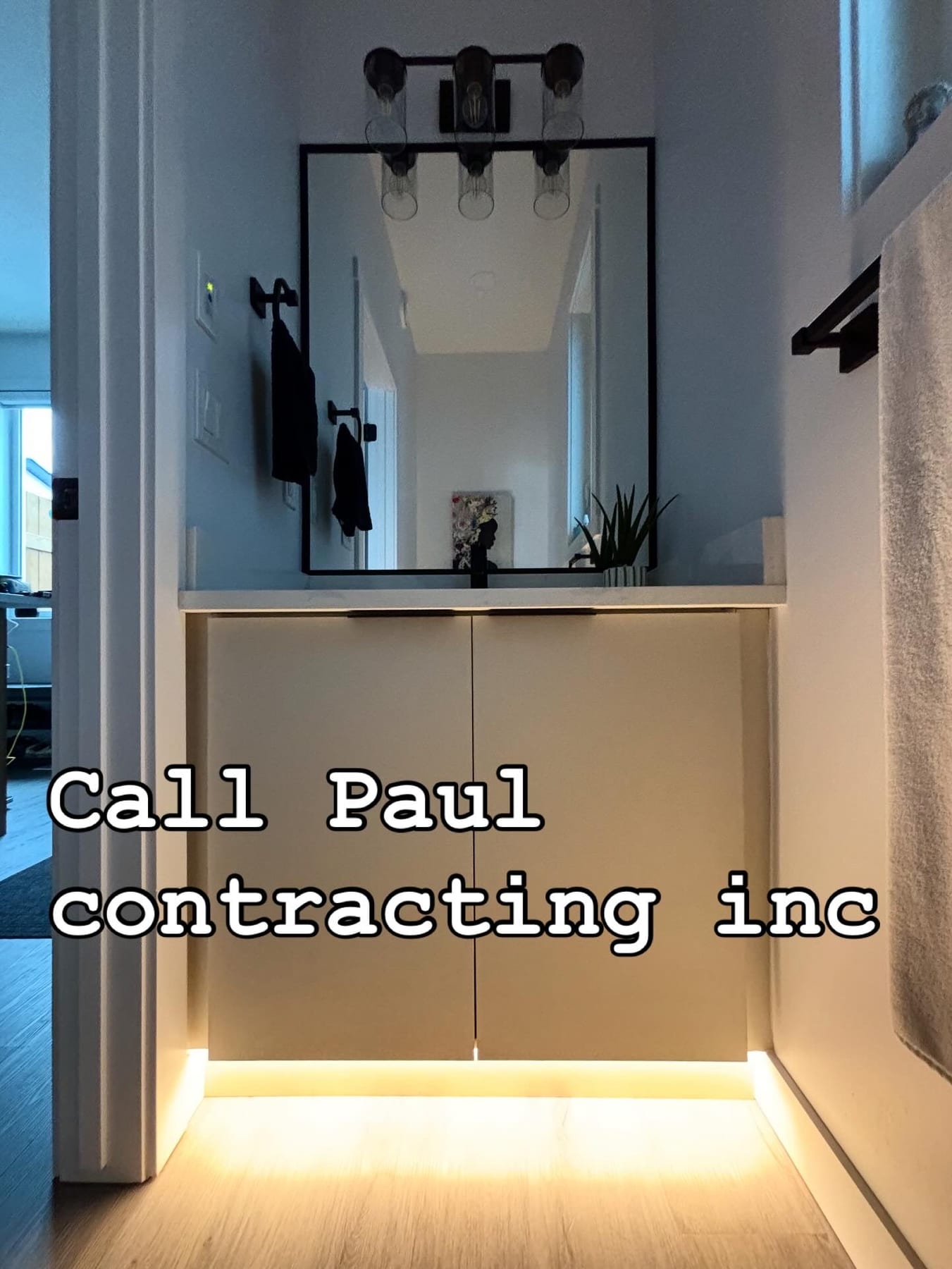 Bathroom vanity light bar and LED accent lighting installed by Call Paul Contracting in Edmonton