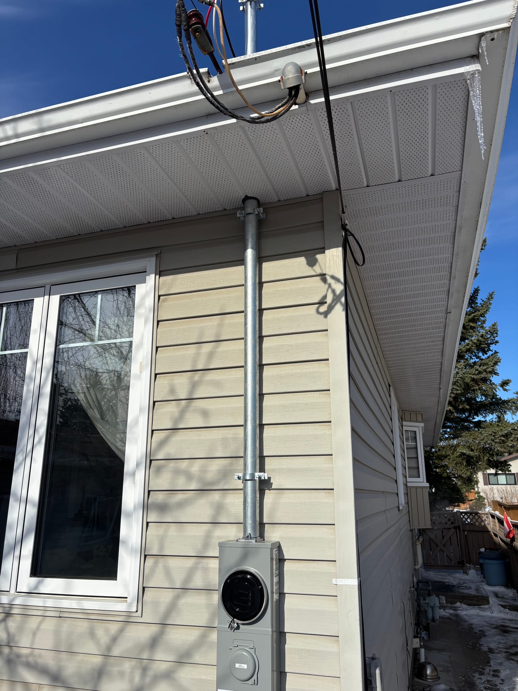 Service mast, weatherhead and meter upgrade on a home by Call Paul Contracting in Edmonton
